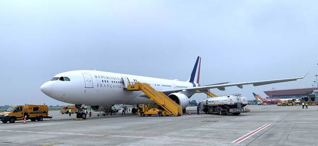 A large airplane with stairs on the groundAI-generated content may be incorrect.
