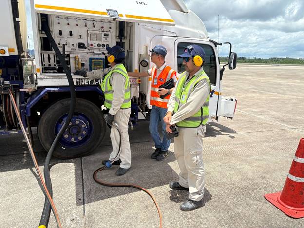 A group of men standing next to a truckAI-generated content may be incorrect.