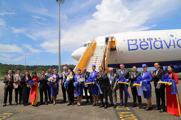 A group of people standing in front of an airplaneAI-generated content may be incorrect.
