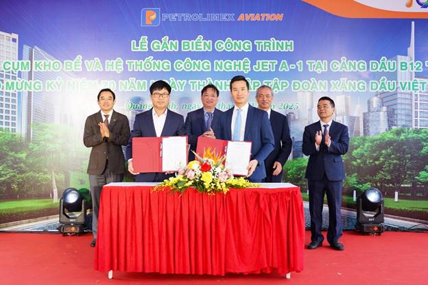 A group of men standing in front of a table with red clothAI-generated content may be incorrect.