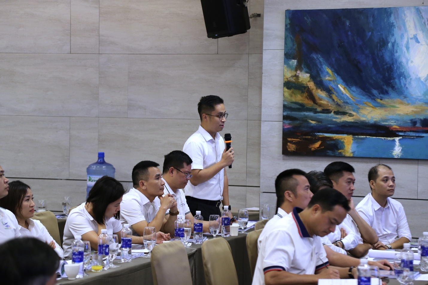 A group of people sitting at a tableAI-generated content may be incorrect.