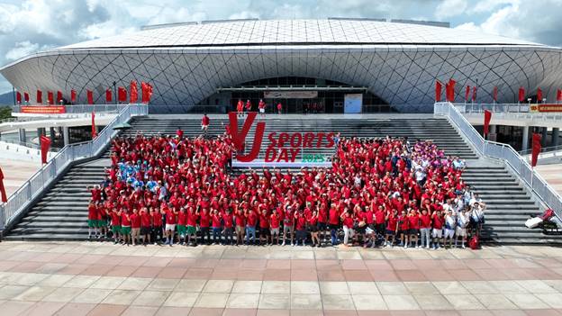 A large group of people in red shirtsAI-generated content may be incorrect.